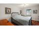 Cozy bedroom with laminate floors, ceiling fan, closet and natural light from the window at 6022 Wilander St, Leesburg, FL 34748