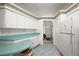 The kitchen features a breakfast bar, white cabinets, and neutral countertops at 6022 Wilander St, Leesburg, FL 34748