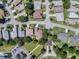 Aerial view of a residential neighborhood showing well-maintained lawns, mature trees, and manicured landscaping at 6122 Sailboat Ave, Tavares, FL 32778