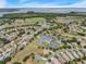 Aerial view of community amenities including pool, tennis courts, and easy access to Lake Harris at 6122 Sailboat Ave, Tavares, FL 32778