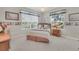 Bright bedroom with two large windows, carpet, and a ceiling fan at 6122 Sailboat Ave, Tavares, FL 32778