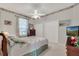 Bedroom featuring carpet, a ceiling fan, two closets, and a tv at 6122 Sailboat Ave, Tavares, FL 32778