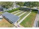 Aerial view of the community bocce ball courts with covered seating in a well maintained lakeside community at 6122 Sailboat Ave, Tavares, FL 32778