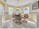 Bright breakfast nook featuring tile flooring, large windows, and a cozy atmosphere at 6122 Sailboat Ave, Tavares, FL 32778