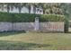 Royal Harbor entrance featuring a decorative lighthouse and lush landscaping at 6122 Sailboat Ave, Tavares, FL 32778