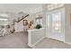 Bright entryway with a dining area to the left and stairs visible in the background at 6122 Sailboat Ave, Tavares, FL 32778