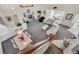 Spacious living room with multiple seating areas, neutral decor, and access to the outdoors at 6122 Sailboat Ave, Tavares, FL 32778