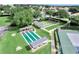 Aerial view of the community shuffleboard courts and bocce ball courts in a well maintained lakeside community at 6122 Sailboat Ave, Tavares, FL 32778