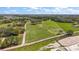 Expansive property featuring open pasture, a pond, and mature trees, perfect for a serene country lifestyle at 6813 S Fork Ranch Dr, Clermont, FL 34714