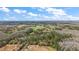 Scenic land featuring a lot of trees, a pond, and grassland, perfect for outdoors adventures and relaxing at 6813 S Fork Ranch Dr, Clermont, FL 34714