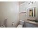 Cozy half-bathroom featuring granite counters and a window at 6813 S Fork Ranch Dr, Clermont, FL 34714