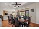 Elegant dining room featuring hardwood floors and doors leading to the outdoor space at 6813 S Fork Ranch Dr, Clermont, FL 34714