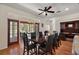 Open dining area with hardwood floors, direct access to screened in lanai, and built-in shelves at 6813 S Fork Ranch Dr, Clermont, FL 34714