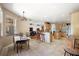 Open-concept kitchen featuring wooden cabinetry, tile flooring, and breakfast bar seating at 6813 S Fork Ranch Dr, Clermont, FL 34714