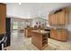 Beautiful kitchen with granite countertops, wood cabinets, and modern appliances at 6813 S Fork Ranch Dr, Clermont, FL 34714