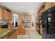 Gourmet kitchen with custom cabinetry, granite counters, and stainless steel appliances at 6813 S Fork Ranch Dr, Clermont, FL 34714