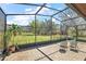 Covered patio area with brick flooring offers picturesque backyard views and room for entertaining at 6813 S Fork Ranch Dr, Clermont, FL 34714