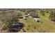 A cluster of RVs parked on a lot surrounded by trees at 6813 S Fork Ranch Dr, Clermont, FL 34714