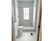 Updated bathroom with tiled shower and modern fixtures at 728 Mckenzie St, Leesburg, FL 34748