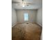 Bedroom featuring tan carpet, neutral paint, and a window with blinds and ceiling fan at 728 Mckenzie St, Leesburg, FL 34748