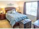 Cozy bedroom with ample natural light and a decorative trunk at 773 Artesia Ave, The Villages, FL 32162