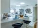 Kitchen features breakfast bar with seating, stainless steel appliances, and ample storage at 773 Artesia Ave, The Villages, FL 32162