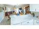 Open floor plan combines kitchen with dining and living room at 773 Artesia Ave, The Villages, FL 32162