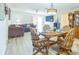 Open floor plan showcases the living room, dining area, and access to the outdoor space at 773 Artesia Ave, The Villages, FL 32162