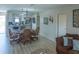 Open living space showing living and dining areas flowing into a modern kitchen at 773 Artesia Ave, The Villages, FL 32162