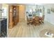 Open living space with dining area adjacent to kitchen and a display case with a glass front at 773 Artesia Ave, The Villages, FL 32162