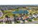 Aerial view showcases home's location near golf course and lake in a residential community at 776 Alcott Ave, The Villages, FL 32162