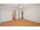 The Primary bedroom features wood floors and easy access to an en-suite bathroom at 776 Alcott Ave, The Villages, FL 32162
