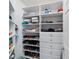Organized walk-in closet with shelves and drawers for ample storage at 776 Alcott Ave, The Villages, FL 32162