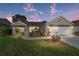 Charming single-story home with well-manicured lawn, landscaped garden, and inviting curb appeal at 776 Alcott Ave, The Villages, FL 32162