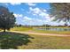 Scenic view of lush golf course with serene lake and expansive green landscape at 776 Alcott Ave, The Villages, FL 32162