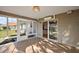 Enclosed lanai with tile flooring and large sliding glass doors for seamless indoor-outdoor living at 776 Alcott Ave, The Villages, FL 32162