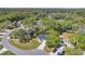 An aerial view showcases the home's location on a corner lot with mature trees and convenient access at 804 Deep Wood Ct, Fruitland Park, FL 34731