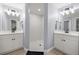 A dual vanity bathroom features a tiled walk-in shower with neutral walls and a light wood floor at 804 Deep Wood Ct, Fruitland Park, FL 34731