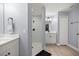 A bathroom showcases a tiled walk-in shower with neutral walls and a light wood floor at 804 Deep Wood Ct, Fruitland Park, FL 34731