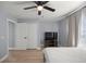 Bright bedroom features a ceiling fan, neutral walls, wood floors, and a spacious closet at 804 Deep Wood Ct, Fruitland Park, FL 34731