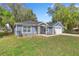 Charming one-story home with a well-maintained lawn, inviting walkway, and attached garage at 804 Deep Wood Ct, Fruitland Park, FL 34731