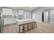 Bright, open kitchen with a large island, white cabinets, and stainless steel appliances at 804 Deep Wood Ct, Fruitland Park, FL 34731