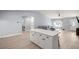 Open-concept kitchen with a breakfast bar that overlooks the living area and includes stainless appliances at 804 Deep Wood Ct, Fruitland Park, FL 34731