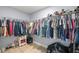 Spacious walk-in closet with ample storage, featuring organized shelving and racks for clothing and accessories at 804 Deep Wood Ct, Fruitland Park, FL 34731