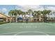 Community basketball court surrounded by palm trees and recreational amenities at 8973 Cat Palm Rd, Kissimmee, FL 34747