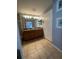 Bathroom featuring double vanity, granite counters, tile floors, and good lighting at 8973 Cat Palm Rd, Kissimmee, FL 34747