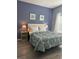 Comfortable bedroom features a queen-size bed, neutral walls, and ample natural light at 8973 Cat Palm Rd, Kissimmee, FL 34747