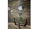 Stylish entryway features a glass console table, decorative mirror, and wood-paneled accent wall at 8973 Cat Palm Rd, Kissimmee, FL 34747