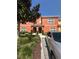 Charming two-story home with mature landscaping and a silver car parked in front at 8973 Cat Palm Rd, Kissimmee, FL 34747