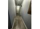 Neutral hallway with a series of white doors at 8973 Cat Palm Rd, Kissimmee, FL 34747